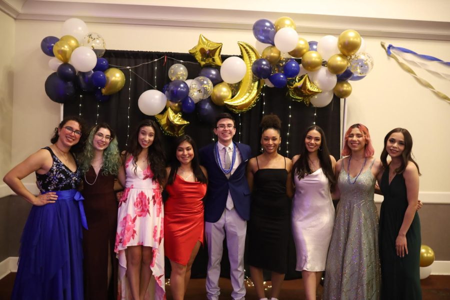 Marianna Gay (far left in blue dress), president of UNIDOS, and organizer Lorena Ianiro second from left in black dress). Michelle Abata is next to Ianiro in the pink dress and  Andrew Abato is in the center, as the UNIDOS executive committee poses at its inaugural Noche de Gala event this week. 