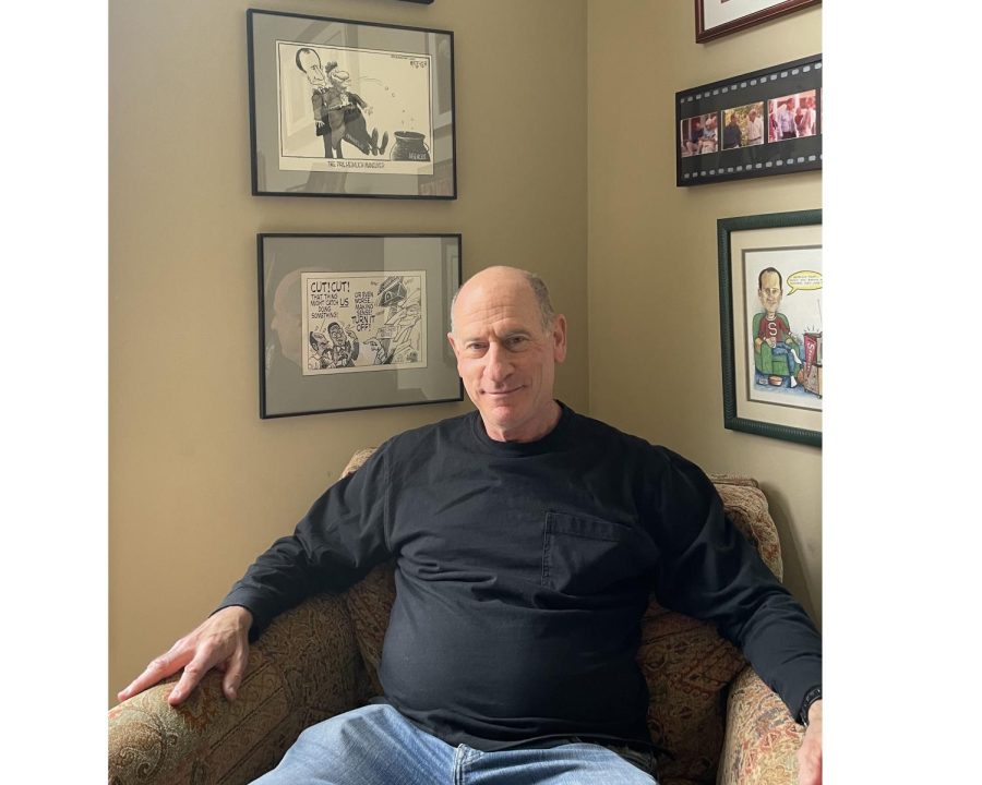 Phil Heimlich, candidate for the Republican nomination for Ohio’s 8th Congressional District, sits at home under framed photos and editorial cartoons depicting points from his earlier political career on Cincinnati City Council and the Hamilton County Commission. 