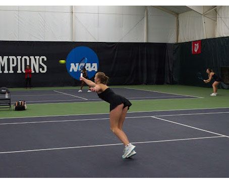 Miami University’s Emelia Valentinsson stretches to return a hit near the net April 3, against Eastern Michigan.