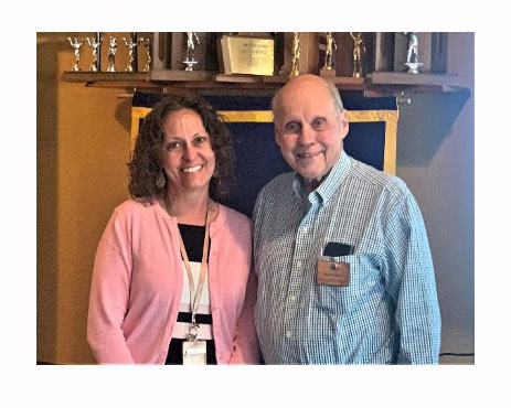 Amy Machechko wins a national award. She is posing here with Dave Kullman. 