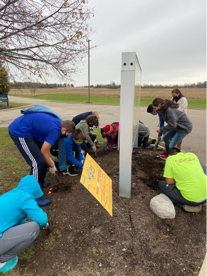 Students in the Builders Club work in project called “Plant the Promise,” combined gardening with an anti-drug message.