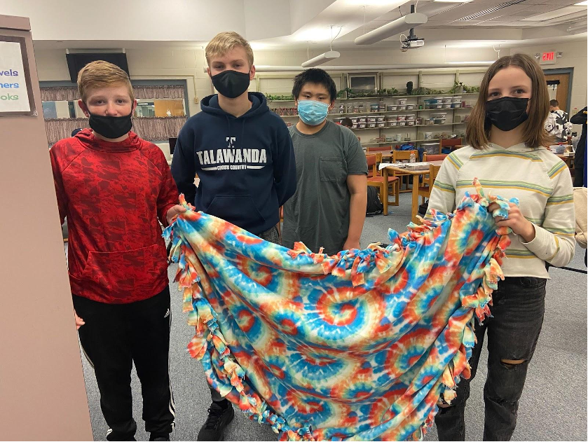 Students in the Builders Club make homemade blankets that are donated to the Family Resource Center. 