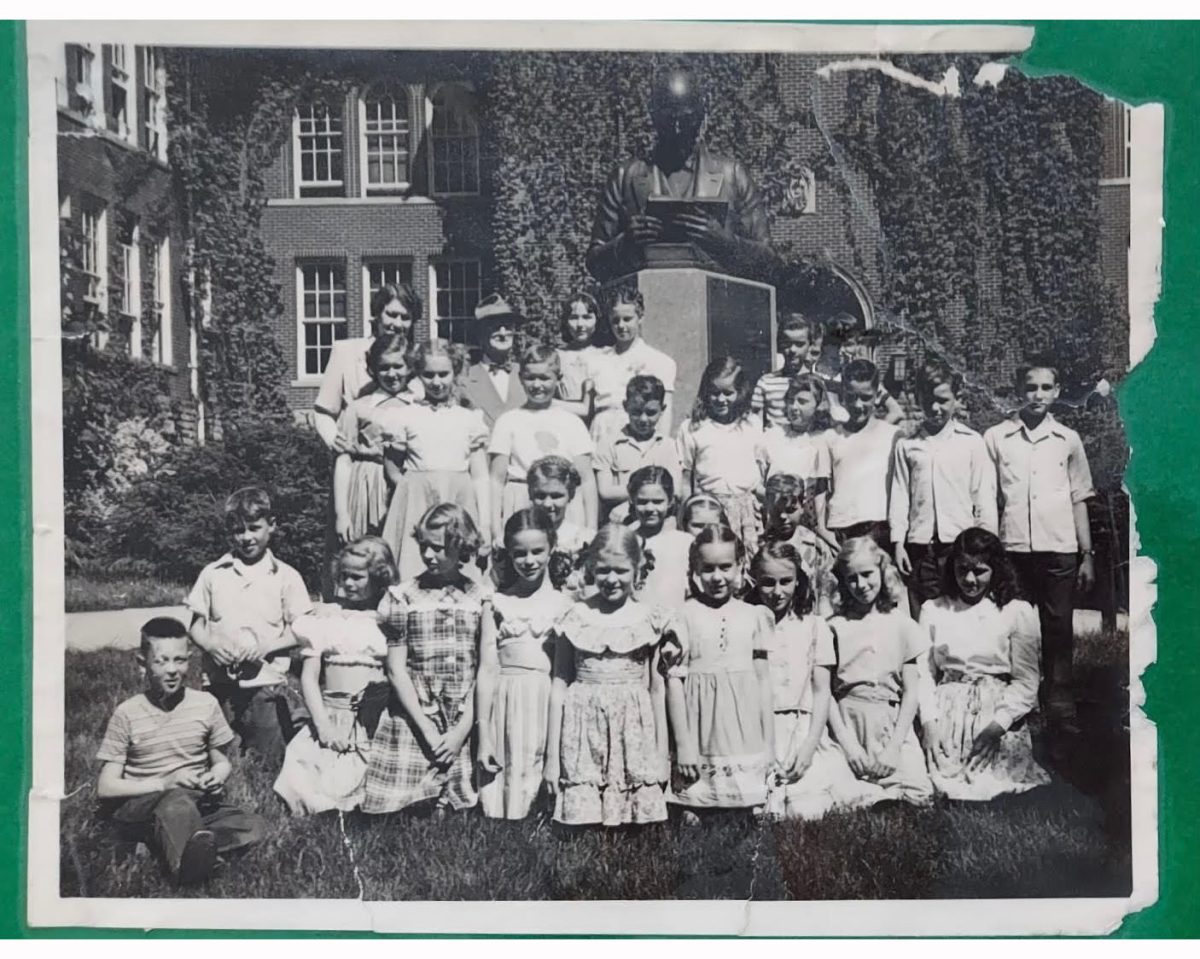 Members of the class of ’56 posed in front of the McGuffey Memorial statue, outside McGuffey Hall,  as children. Photo provided by Nora Ellen Shera Bowers