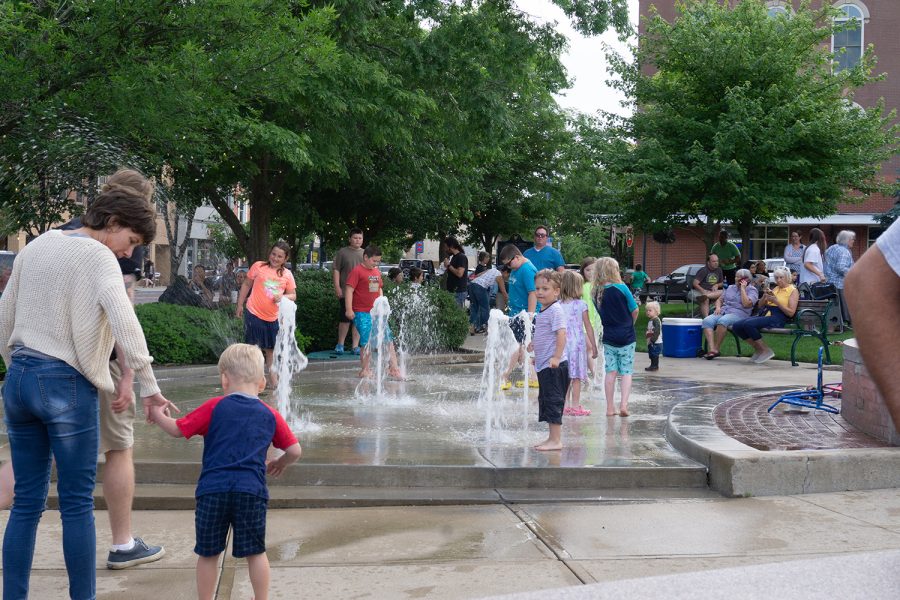 Children play in the park’s splash area during the festivities. 
