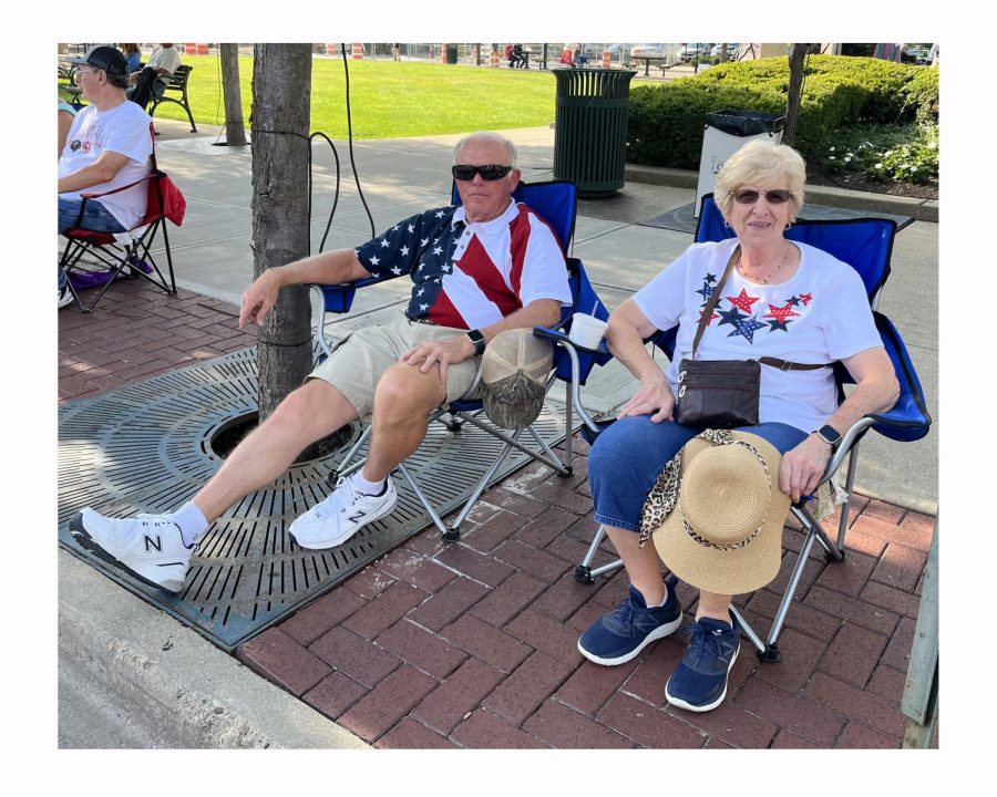 Merci Masters and Jim Brown from Oxford find an early seat for the Oxford Fourth of July parade on High Street Saturday. Photo by Sacha DeVroomen Bellman