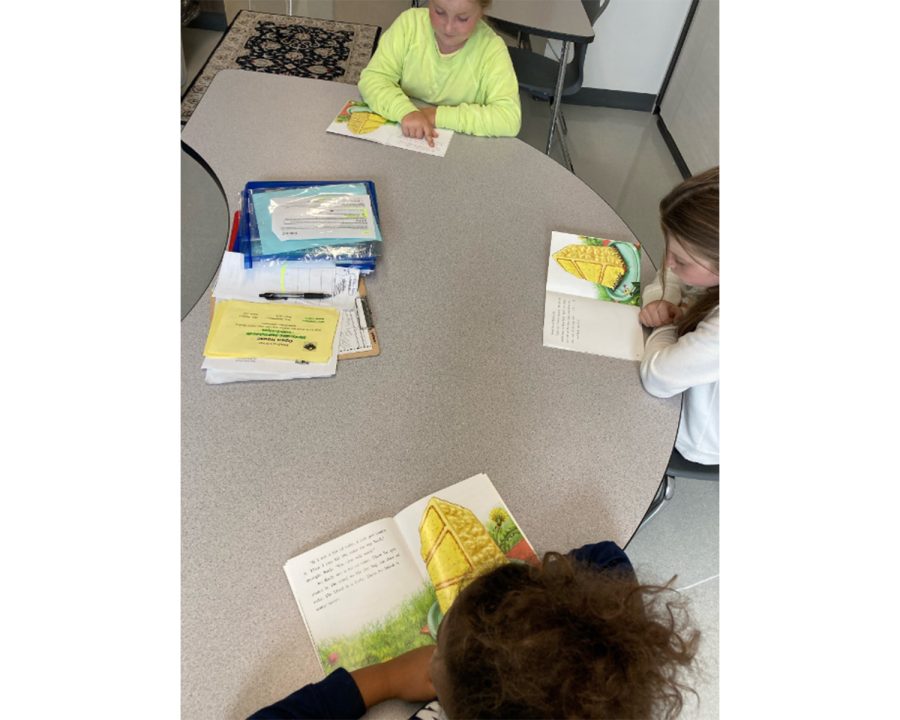 Third graders (from far side) Hannah Chaney, Lucy Chaney, and Jalen Douglas read in a classroom at Kramer Elementary School in Oxford. The Talawanda School District is seeking an operating levy to continue multiple educational and extracurricular programs for its students.