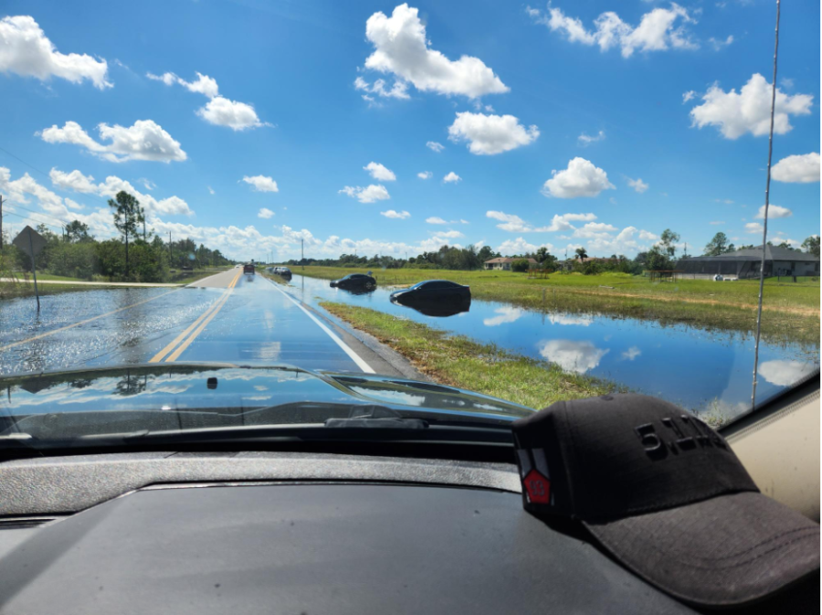 Flooded and abandoned cars lined the road in the wake of Hurricane Ian.