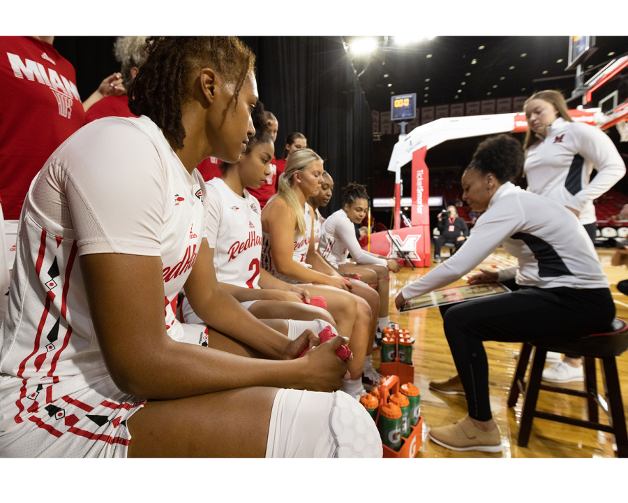 Miamis+womens+basketball+team+discusses+gameplay+on+the+bench.