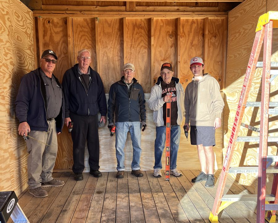 Kiwanis volunteers Dave Mabry, John Skillings, Bill Wortman, Jim Kehr and Douglas Ingram stand inside the shed under renovation. 