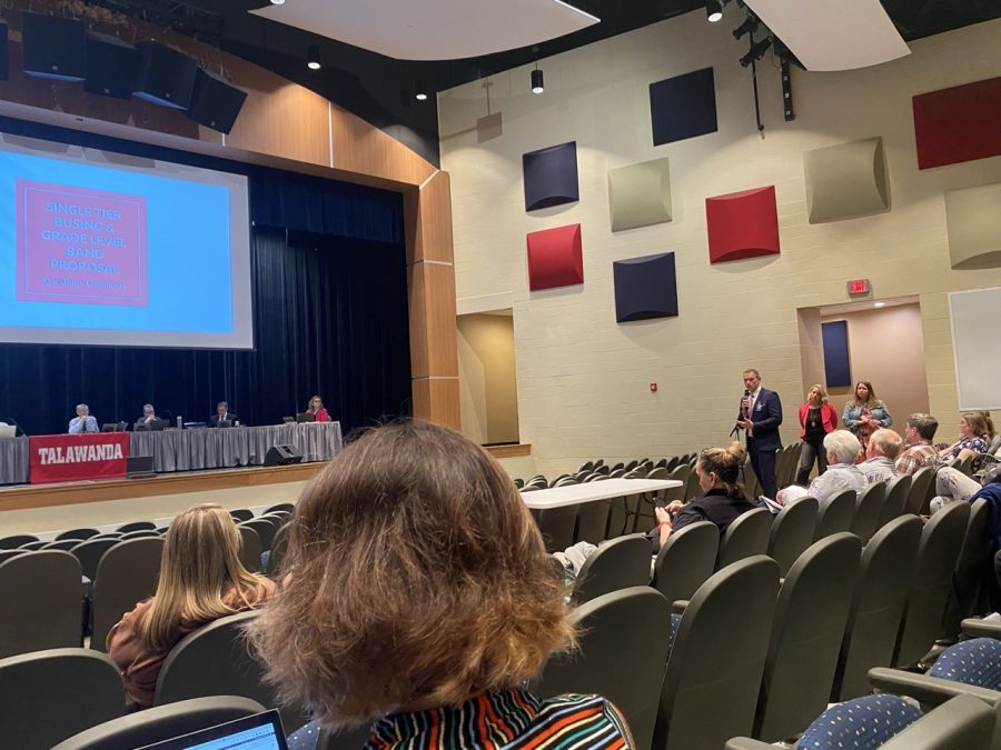 Talawanda High School principal Scott Davie and assistant principal Rebekah Butz present a cost-cutting plan to the Talawanda School Board.