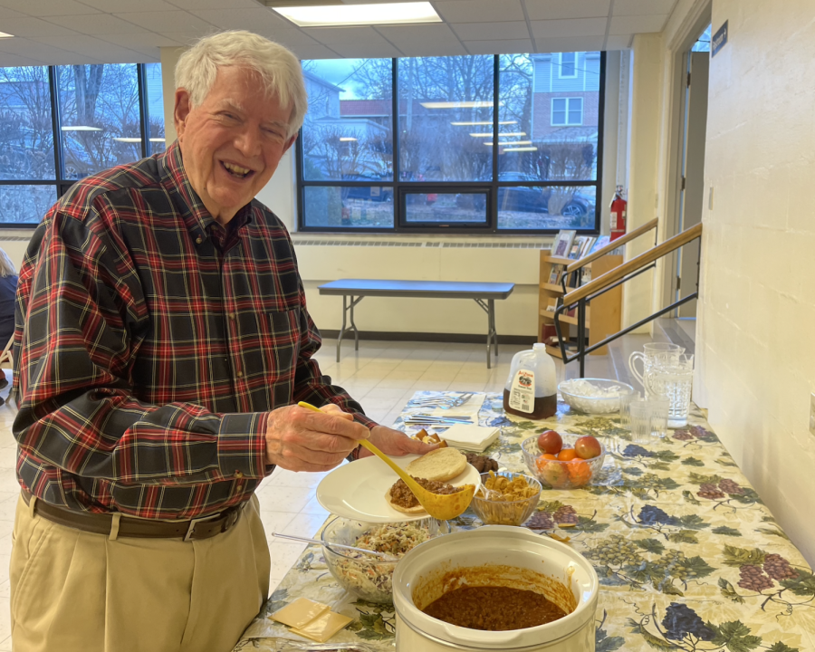 Jack Southard makes his own plate after serving the community members. 


