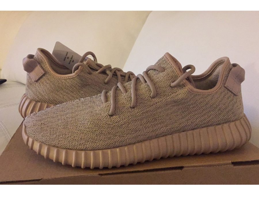 A pair of Adidas Yeezy Boost  in “oxford tan.


