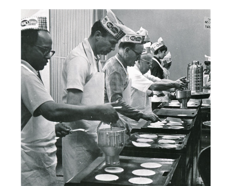 Kiwanians prepare pancakes during a Pancake Day event at the Oxford United Methodist Church in the 1970s.