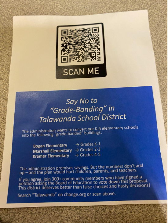 Fliers at the Kramer Elementary information session directed parents to sign an online petition against the board’s plan to divide students among the three elementary schools by grade.