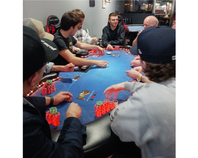 A full table of poker players get ready to play at Newgate Poker Club on April 5. 
