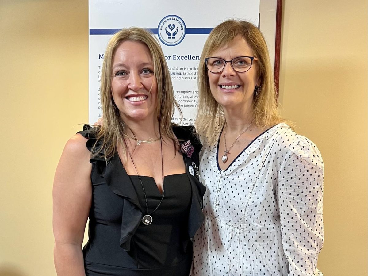 Angela Downward, left, receives the Mc-Cullough Hyde Foundation Mock Family Award for Excellence in Nursing.