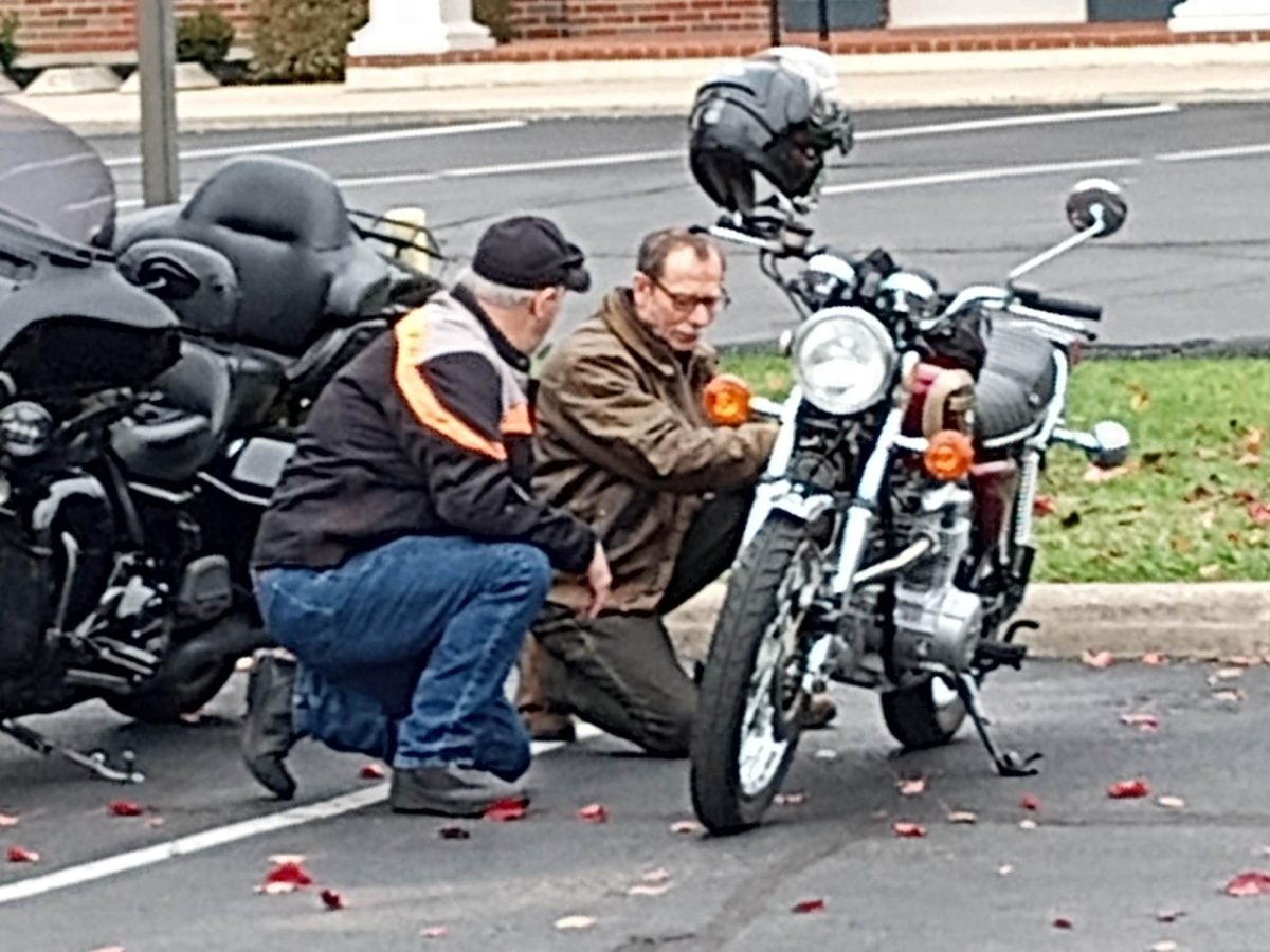 Two local bikers talk shop as they admire one of the bikes at the Oxford Motorcycle Rally.