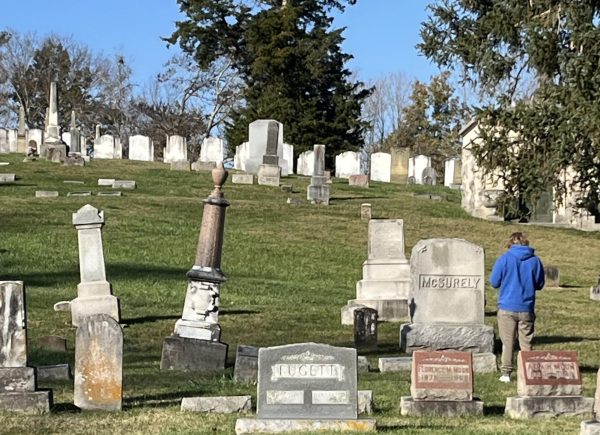 A fall semester advanced GIS student takes photos of headstones in Oxford Cemetery to catalog in a database. Photo provided by Robbyn Abbitt.