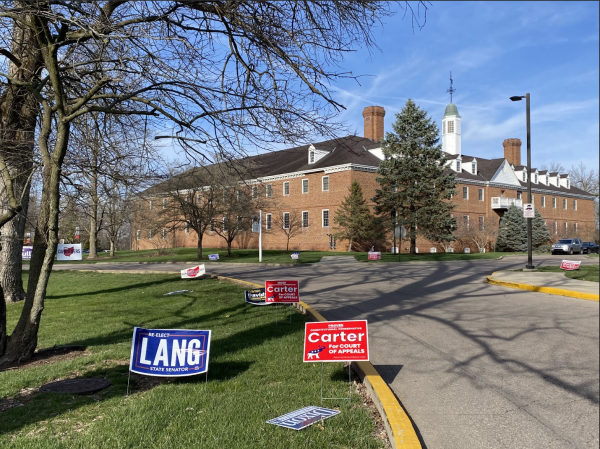 Candidate signs line the entrance to the polling location at The Marcum Hotel & Conference Center on Miami University’s campus. 