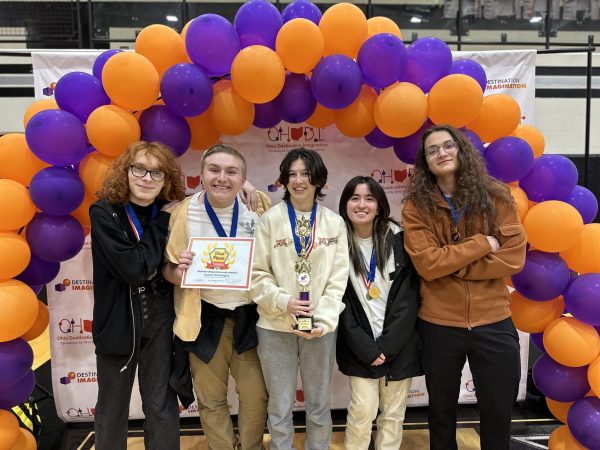 (From left to right) Thea Holley, Bryce Wortman, Addison Greene, Ysabella (Izzy) Anders and Kai Ironstrack pose with their 1st place trophy from Ohio’s state destination imagination (DI) competition on April 6. Photo provided by Jessica Greene, parent of the Oxford area DI team.