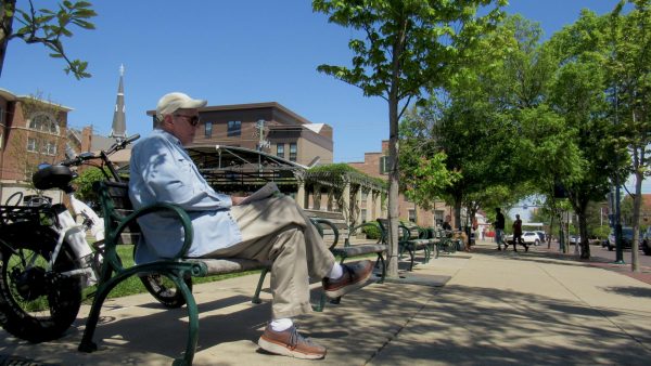 Uptown Oxford benches host longer visits in sunny weather. 
