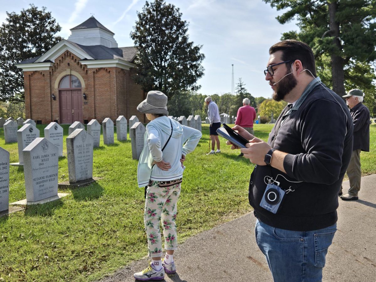 Brad Spurlock, director of the Smith Library of Regional History, recalls the lives of historically significant Oxford residents while his audience explores the headstones of Oxford Cemetery.