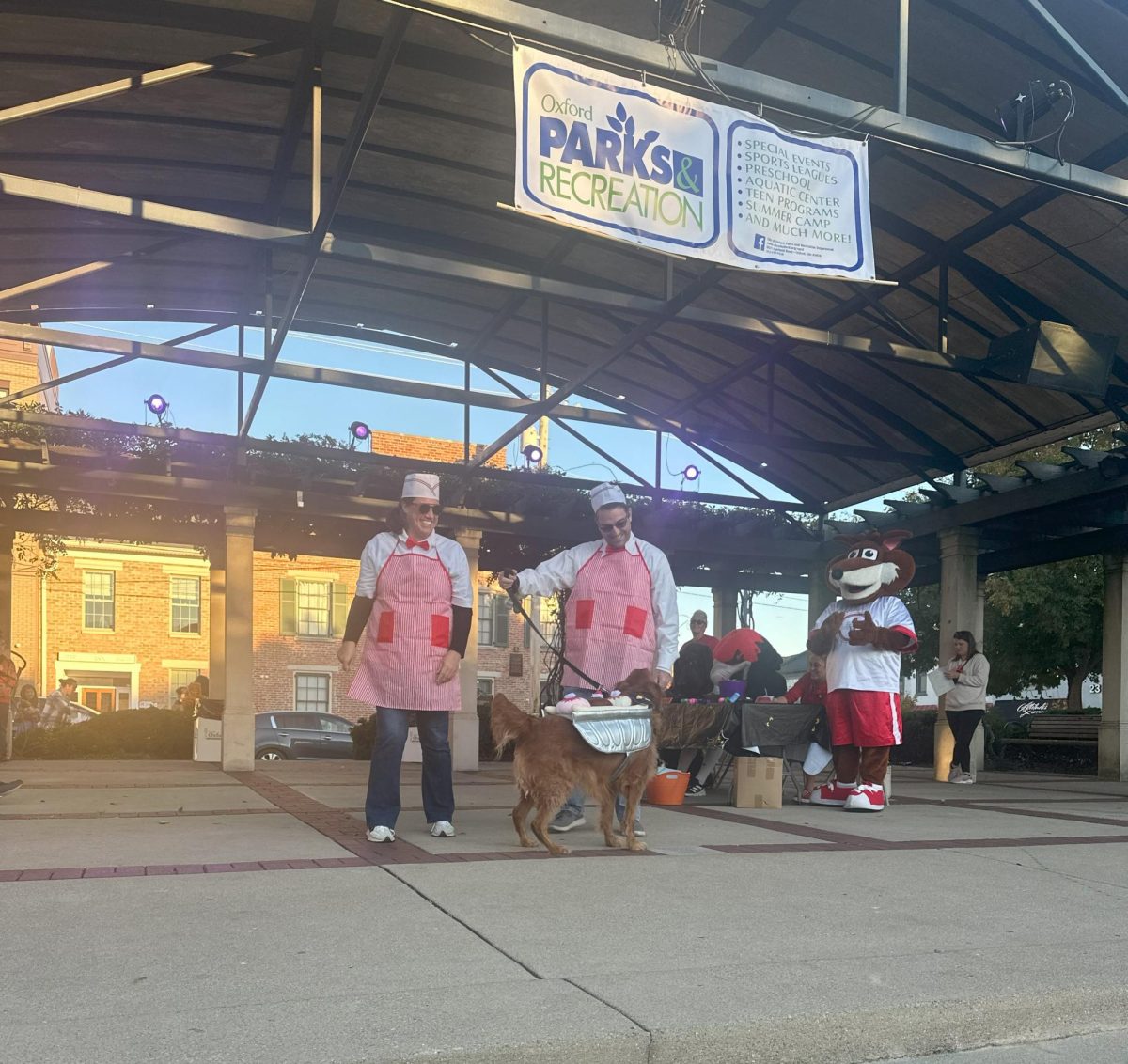 Gordy dressed as a banana split with his owners who escorted him on stage as diner employees. 