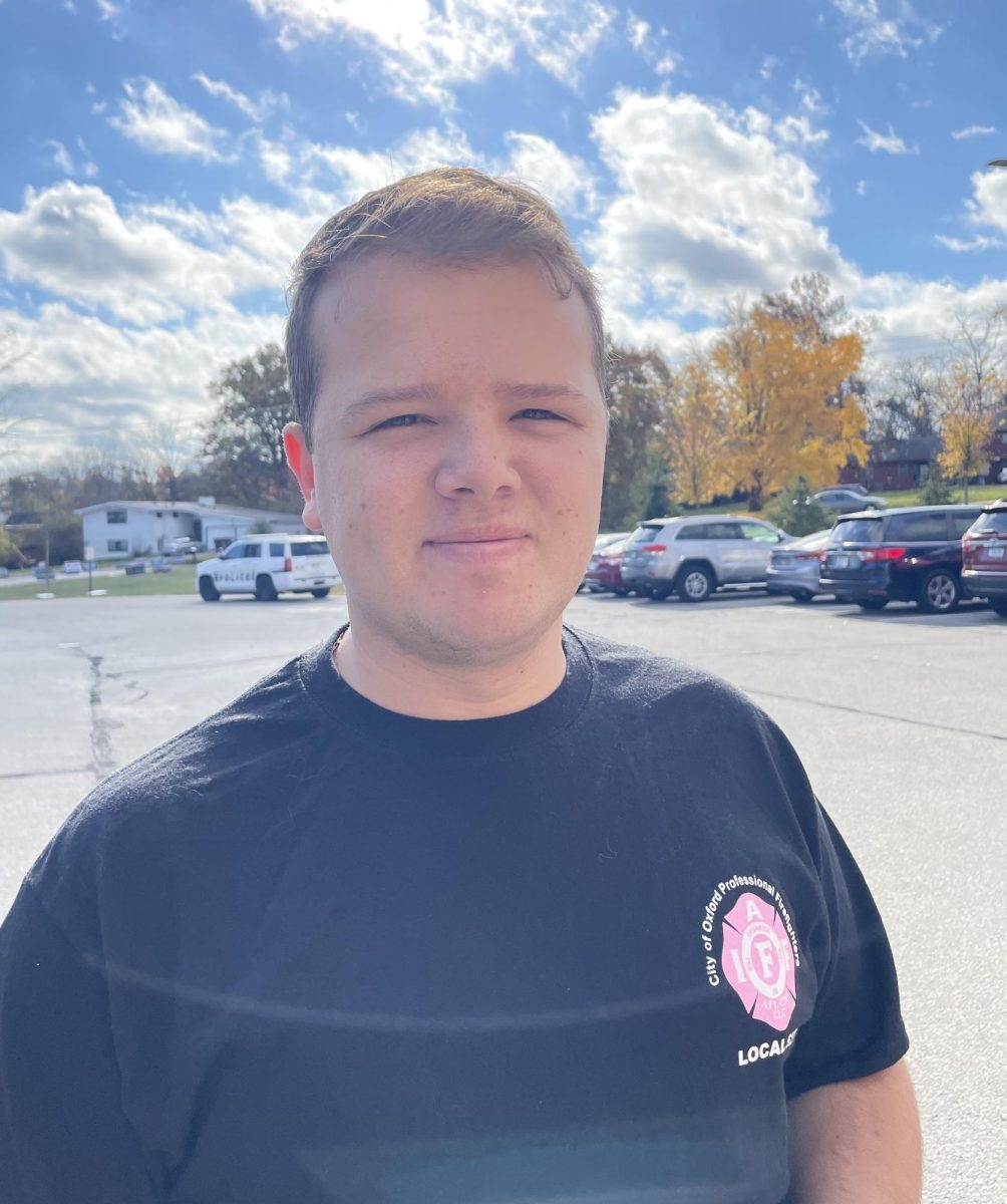 Oxford firefighter and EMT Colson Bryan smiles for the camera after casting his vote at Kramer Elementary.  