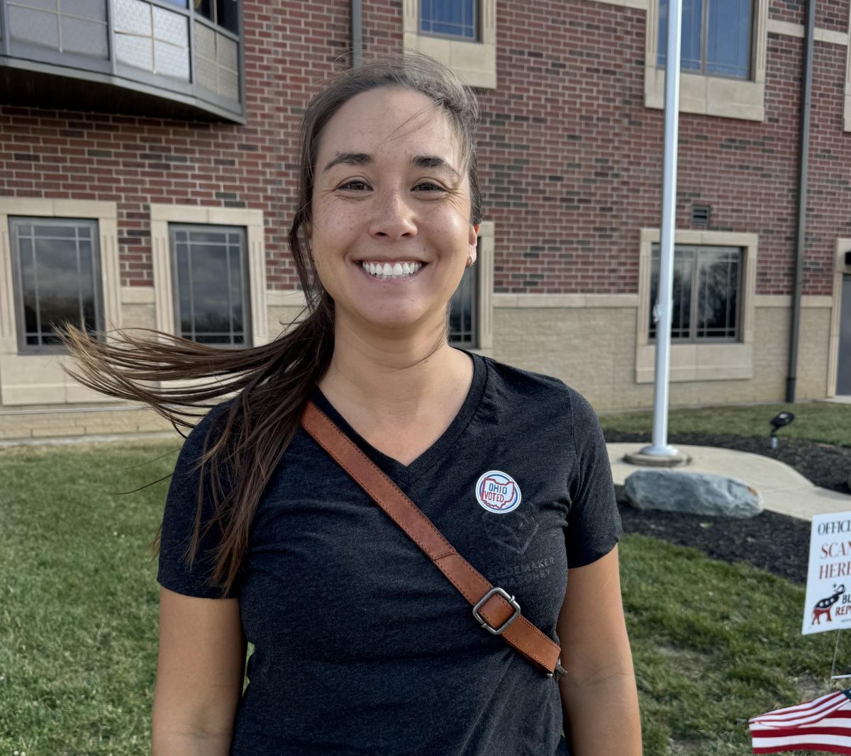 Maya Shoemaker smiles for the camera after casting her vote. 