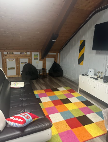 The Attic has plenty of seating for kids to sit in while playing video games. 