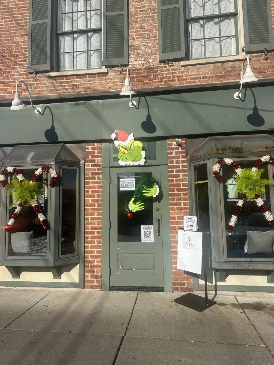 Uptown Blends made their window decorations pop with popular Christmas character, The Grinch. 