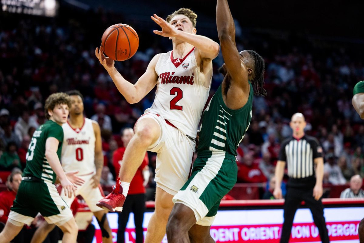 Sophomore guard Evan Ipsaro attempts a layup against Ohio University at Millett Hall Feb. 1. The efforts of Ipsaro and his teammates ended in a 73-69 win against the Bobcats. 