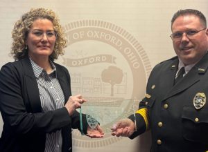 Lieutenant Lara Fening ( and Chief John Jones at Fening's retirement ceremony at the city council meeting Feb. 4. Photo provided by the Oxford Police Department).