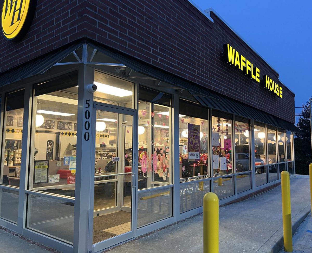 Waffle House exterior and interior adorned in colorful Valentine’s decor. 
