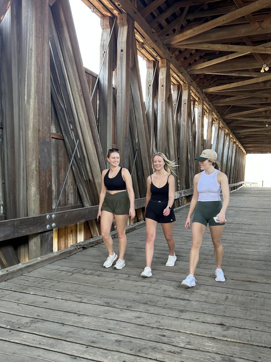 Lindsay Warran, Madison Burton and Austyn Overman enjoy their walk inside the Black Covered Bridge. Photo by Riley Crabtree.