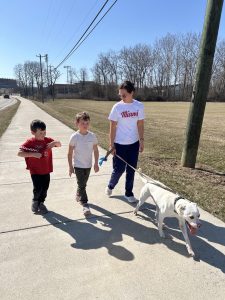 Catrina Jackson and her children, Jett and Jace, along with their pet Bo, walk along the Leonard G. Howell Park trail. Photo by Riley Crabtree.