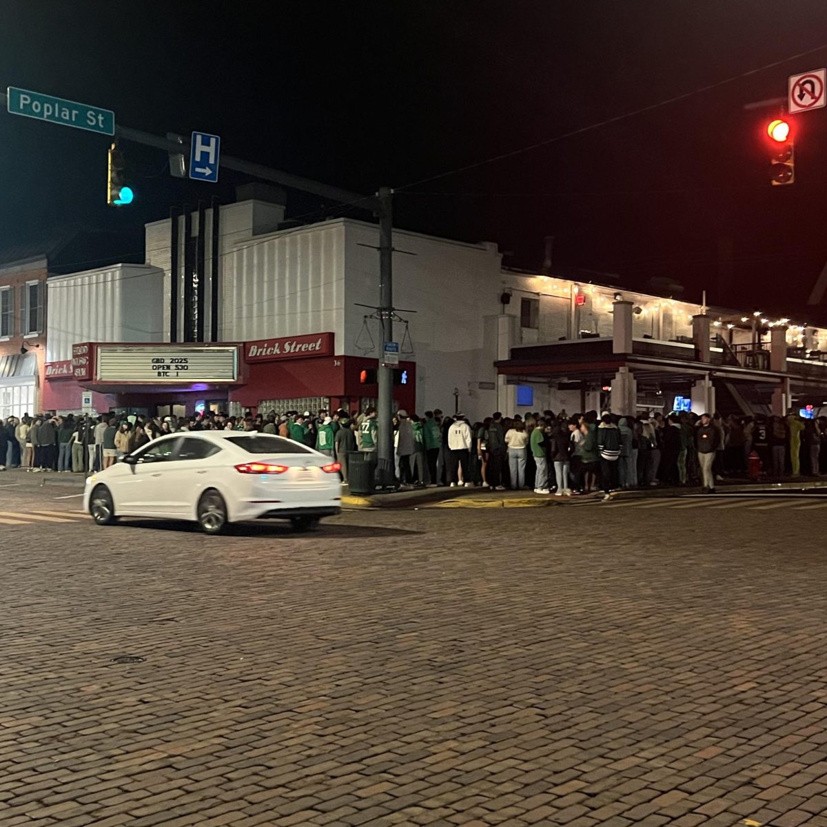 The ever-growing line outside of Brick Street at 5:30 a.m. as students and residents began to celebrate Green Beer Day. Photo by Joe Zak.