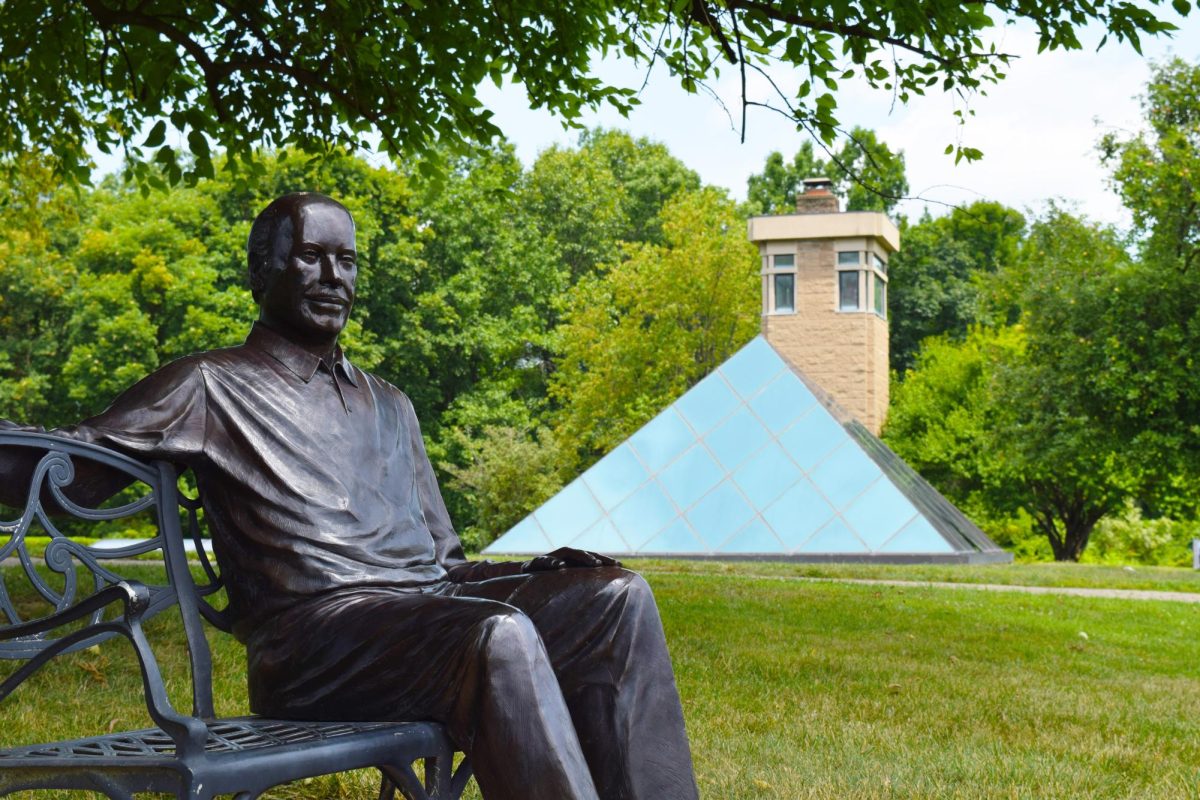 Statue of the founder, Harry T. Wilks, with the Pyramid House behind him. 