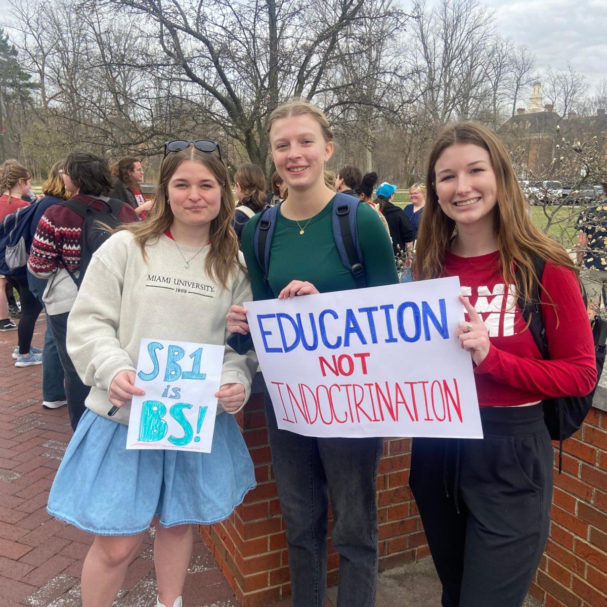 Aubrey Bryan, Allison Kacmarcik, Lily Jarosik 

Aubrey Bryan, Allison Kacmarcik, Lily Jarosik come with book bags from class to join the protest for their education. 
